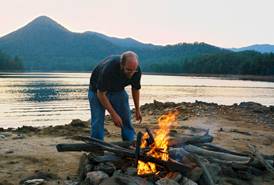Tending a campfire on the Santeetlah shoreline